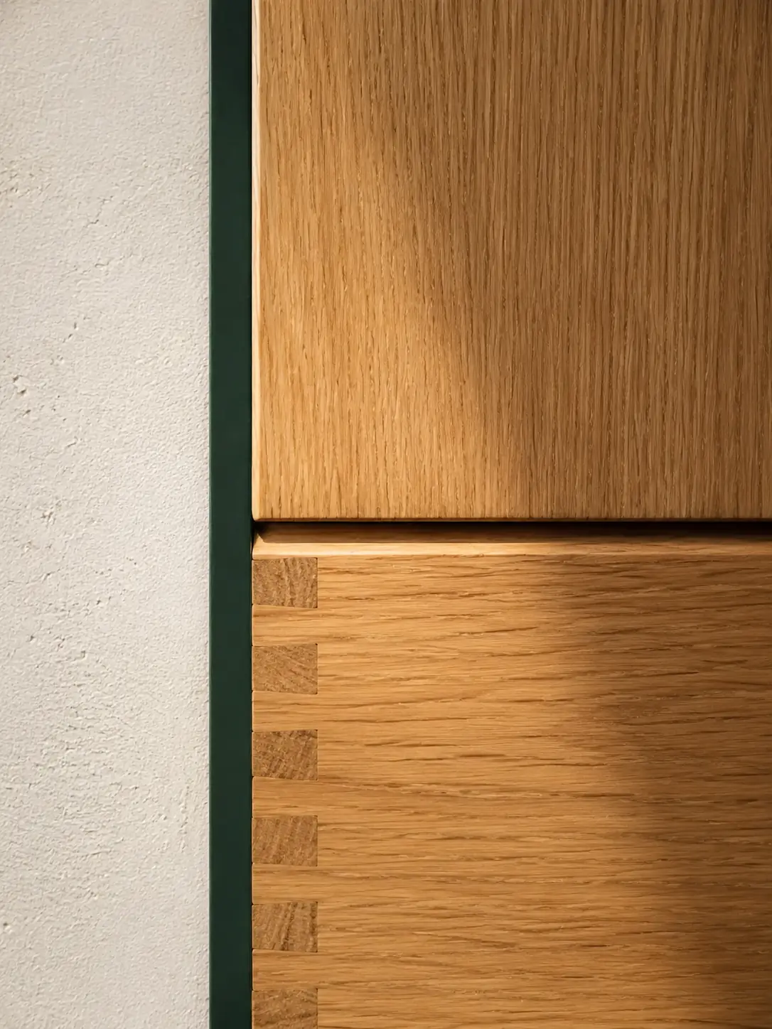 Hand-finished natural oak joinery in warm grazing light